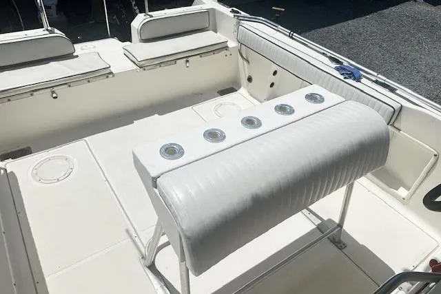 Slide: The Image of 1997 Sea Cat Catamaran interior with white seating and rod holders. - 15