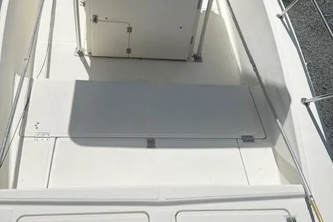 Slide: The Image of 1997 Sea Cat Catamaran deck with storage compartments and railing. - 16