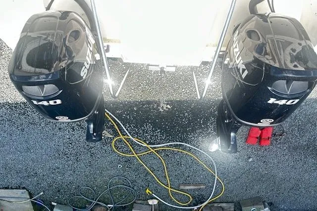 Slide: The Image of Twin Suzuki 140 engines on a 1997 Sea Cat Catamaran, viewed from above. - 21