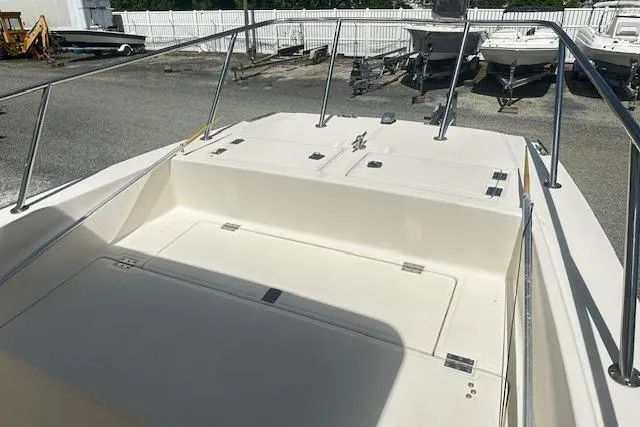 Slide: The Image of 1997 Sea Cat Catamaran deck view with white railing and storage compartments. - 18