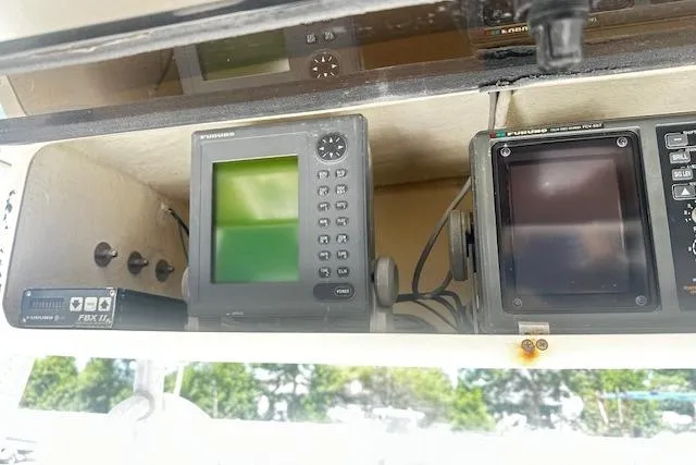 Slide: The Image of Navigation equipment inside a 1997 Sea Cat Catamaran, featuring Furuno displays. - 9