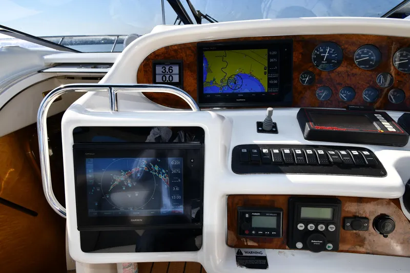 Slide: The Image of Control panel of 1996 Sunseeker 55 CAMARGUE yacht with navigation screens and gauges. - 14