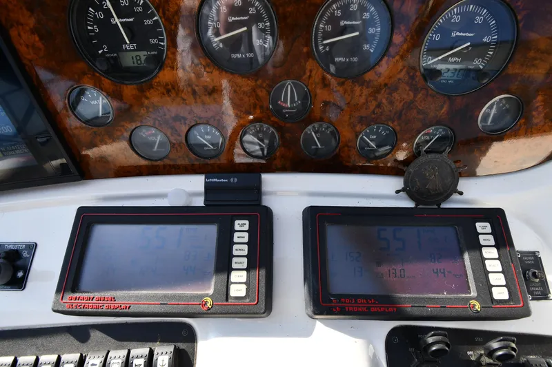 Slide: The Image of Dashboard of a 1996 Sunseeker 55 CAMARGUE yacht with gauges and digital displays. - 15