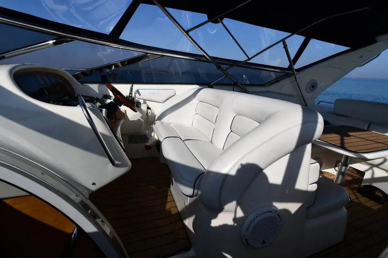 Slide: The Image of Interior of 1996 Sunseeker 55 CAMARGUE yacht with white seating and wooden flooring. - 20