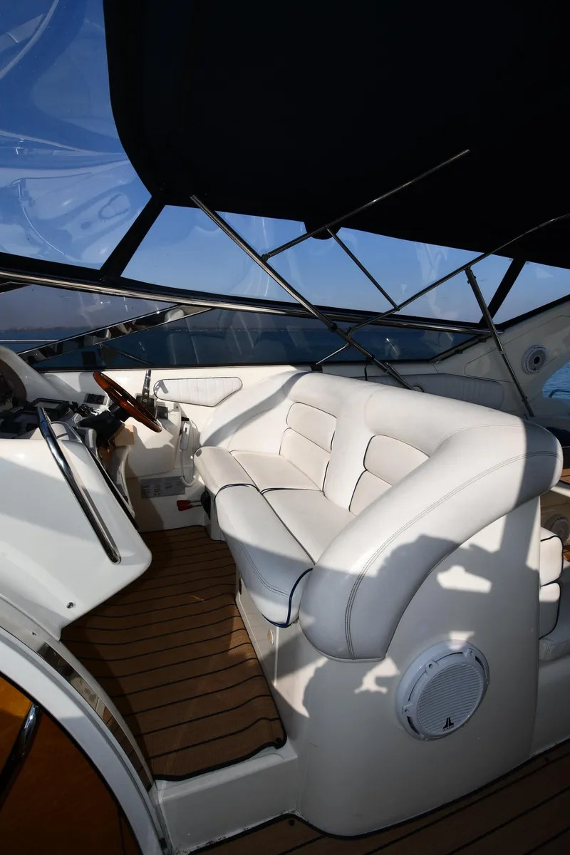 Slide: The Image of Luxurious interior of 1996 Sunseeker 55 CAMARGUE yacht with white seating and wooden flooring. - 21