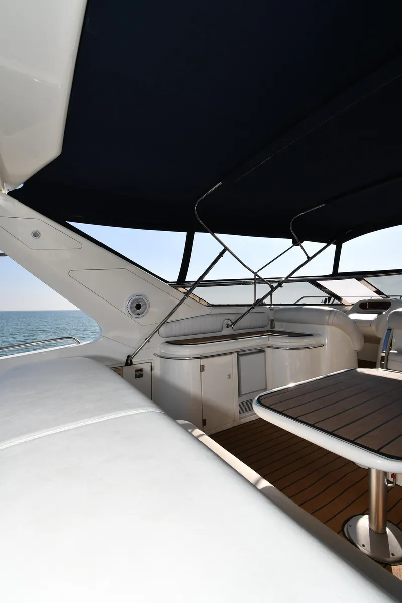 Slide: The Image of 1996 Sunseeker 55 CAMARGUE yacht deck with seating and ocean view. - 27