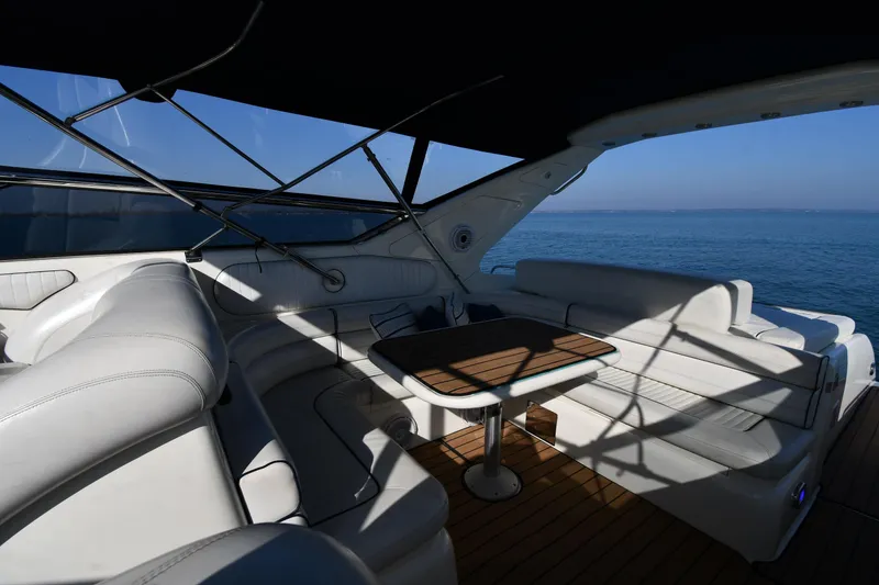 Slide: The Image of Luxurious 1996 Sunseeker 55 CAMARGUE yacht interior with elegant seating and ocean view. - 28