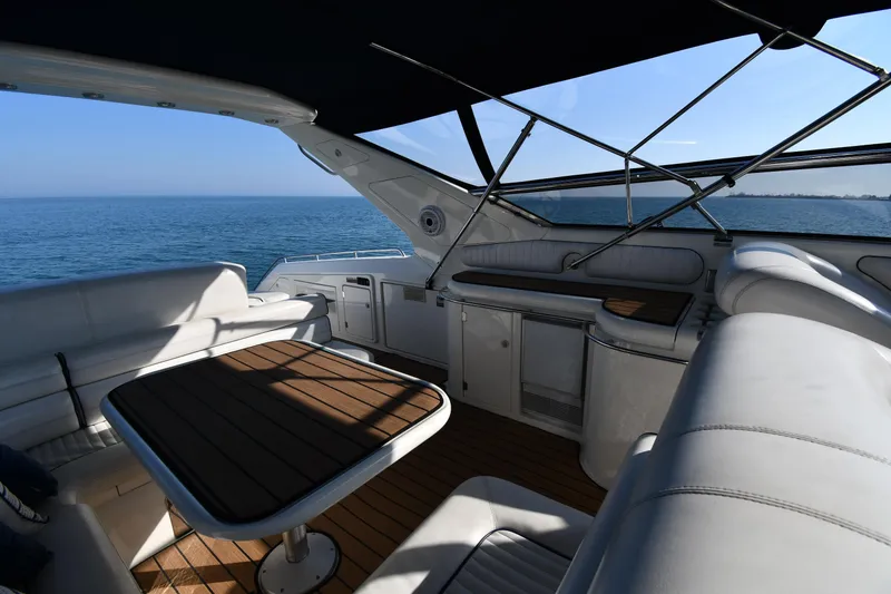 Slide: The Image of Luxurious 1996 Sunseeker 55 CAMARGUE yacht interior with ocean view and elegant seating area. - 29