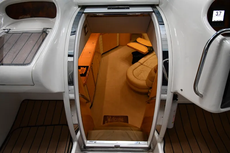 Slide: The Image of Interior view of 1996 Sunseeker 55 CAMARGUE yacht, featuring luxurious seating and cabinetry. - 37