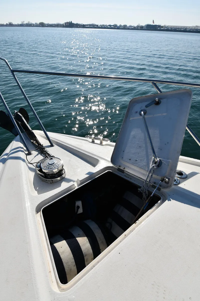 Slide: The Image of Open hatch on 1996 Sunseeker 55 CAMARGUE yacht, overlooking calm water. - 5
