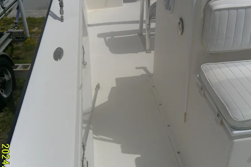 Slide: The Image of 2008 KenCraft 2260 BAYRIDER boat interior with white seating and deck details. - 13