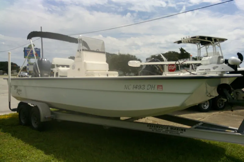 Slide: The Image of 2008 KenCraft 2260 BAYRIDER boat on trailer, parked outdoors. - 2
