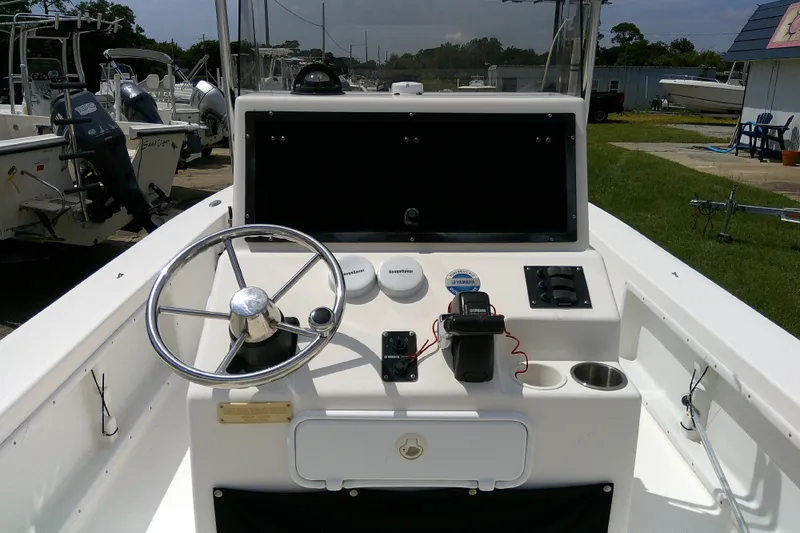 Slide: The Image of 2008 KenCraft 2260 BAYRIDER boat console with steering wheel and controls. - 21