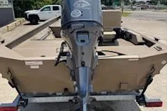 Slide: The Image of 2023 SeaArk RX170 SC boat with outboard motor, parked on a trailer. - 4