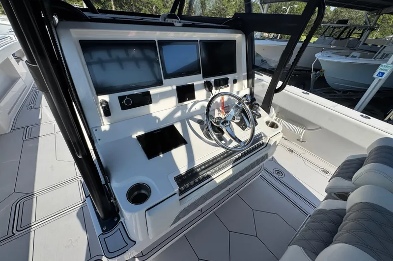Slide: The Image of 2023 Invincible 35 Catamaran helm with modern controls and sleek design. - 32