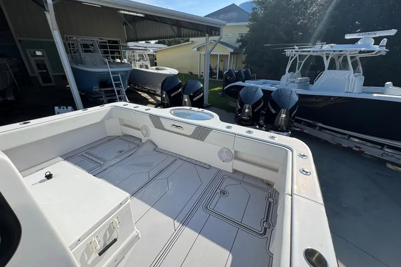 Slide: The Image of 2023 Invincible 35 Catamaran with spacious deck and powerful Mercury engines. - 38