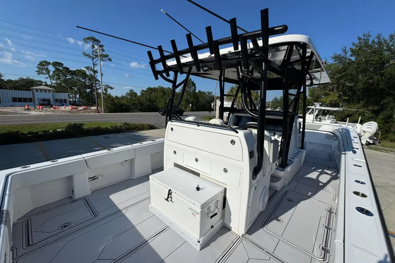 Slide: The Image of 2023 Invincible 35 Catamaran with spacious deck and modern design, docked outdoors. - 42