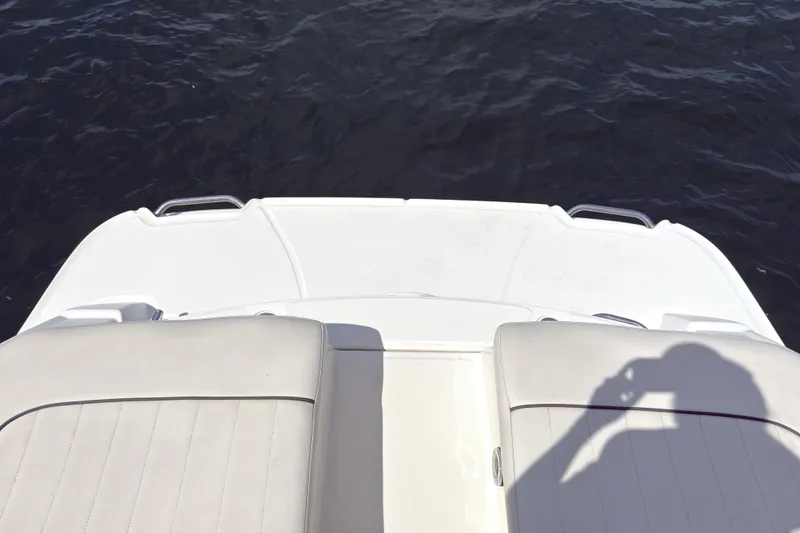 Slide: The Image of Rear view of 2007 Sea Ray 250 SLX boat with water in the background. - 14