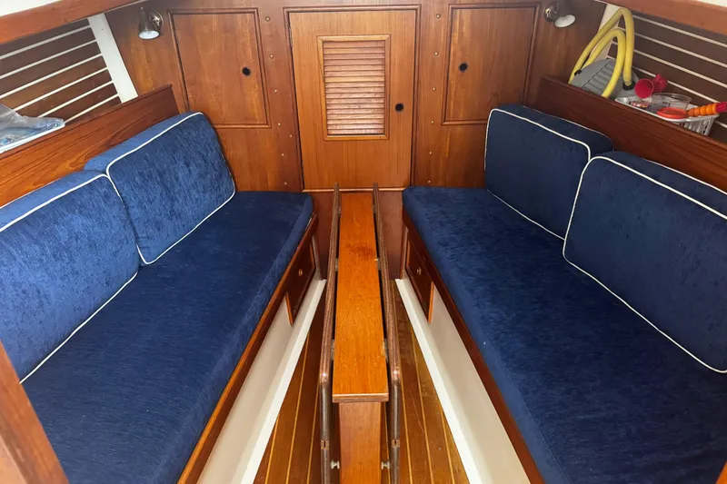 Slide: The Image of Interior of 1984 Nonsuch 26 Classic sailboat with blue cushioned seating. - 16