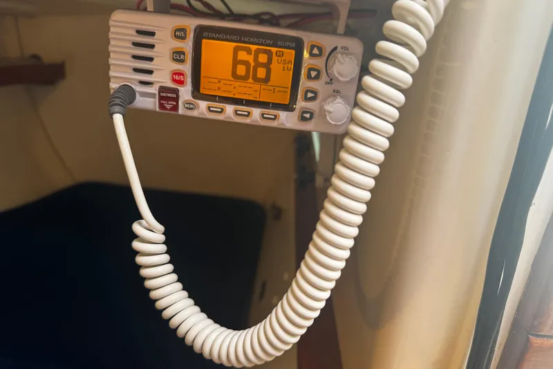 Slide: The Image of VHF radio on 1984 Nonsuch 26 Classic sailboat, displaying channel 68. - 19