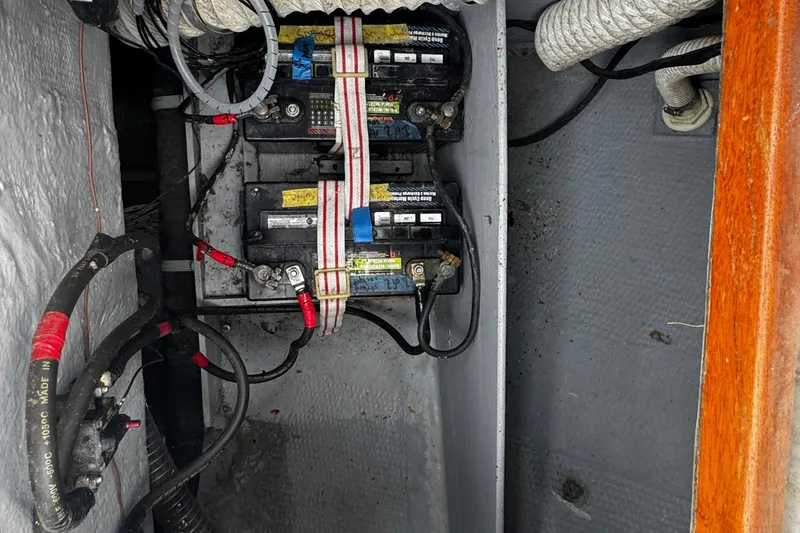 Slide: The Image of Battery compartment of a 1984 Nonsuch 26 Classic sailboat, showing wiring and connections. - 33