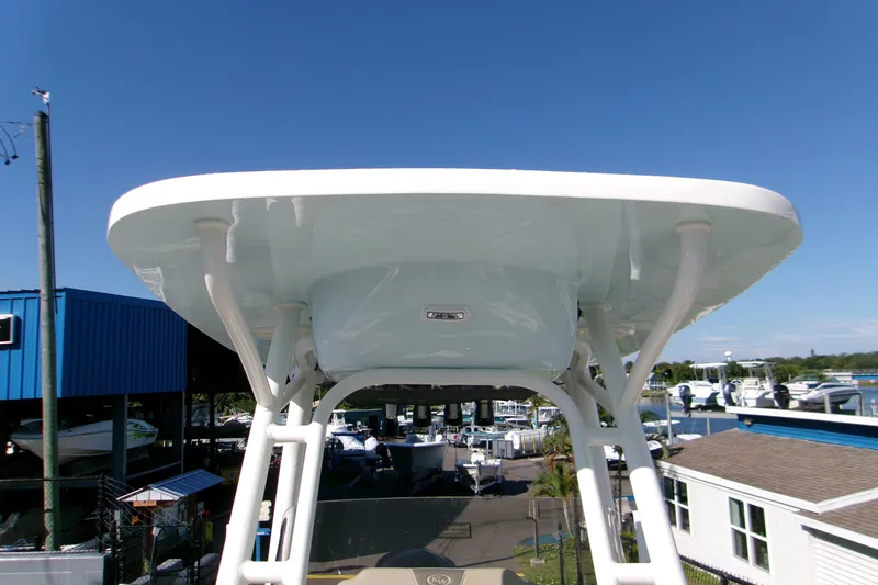 Slide: The Image of 2026 Key West 239 FS boat with T-top, marina background, clear blue sky. - 10