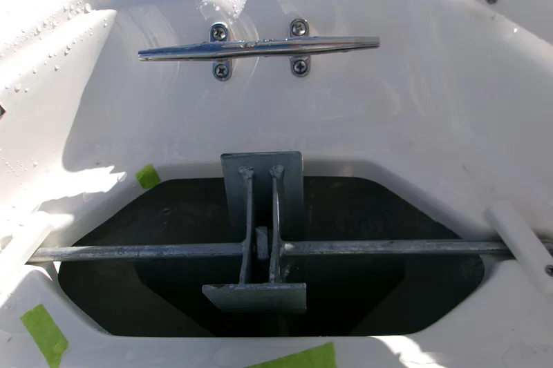 Slide: The Image of 2026 Key West 239 FS boat anchor compartment with metal cleat and hardware. - 12