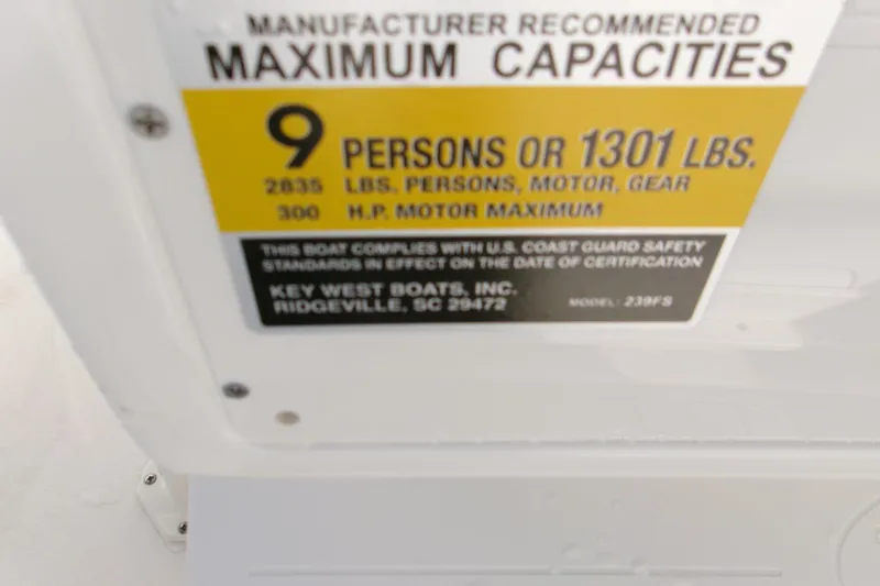 Slide: The Image of Key West 239 FS 2026 boat capacity label: 9 persons or 1301 lbs, 300 HP max. - 7