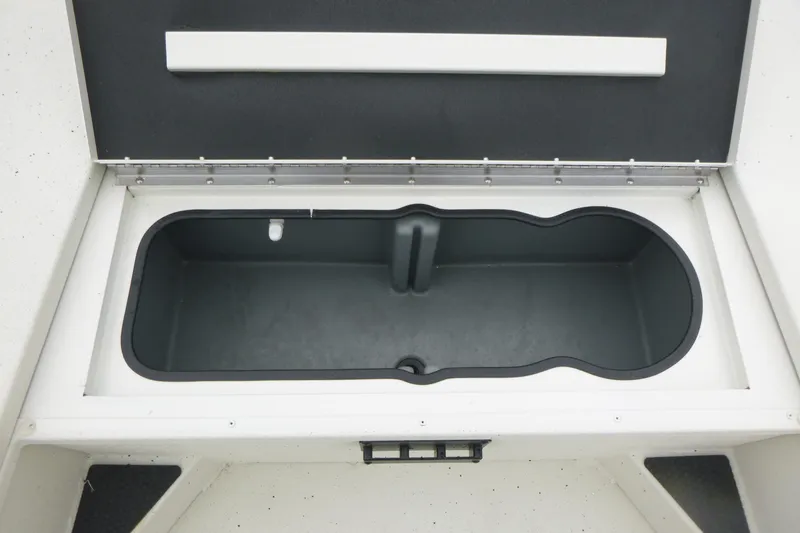 Slide: The Image of 2025 Ranger RB210 boat storage compartment, open lid, spacious interior design. - 10