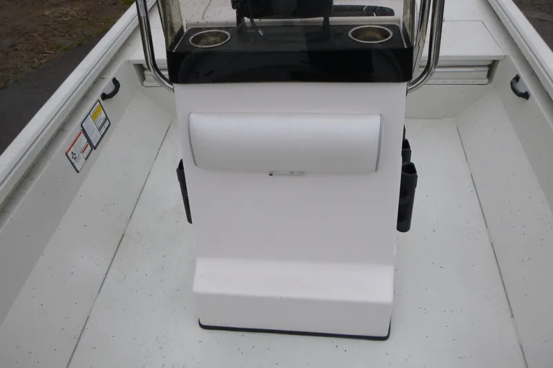 Slide: The Image of 2025 Ranger RB210 boat interior with console and cup holders. - 12