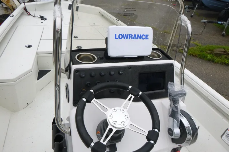 Slide: The Image of 2025 Ranger RB210 boat console with steering wheel and Lowrance navigation system. - 14
