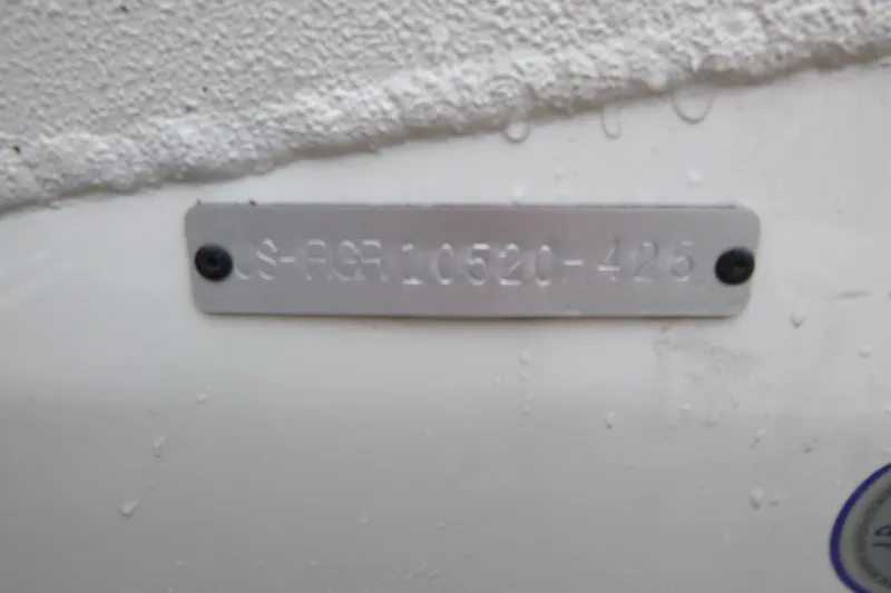 Slide: The Image of 2025 Ranger RB210 identification plate with embossed serial number on textured surface. - 19