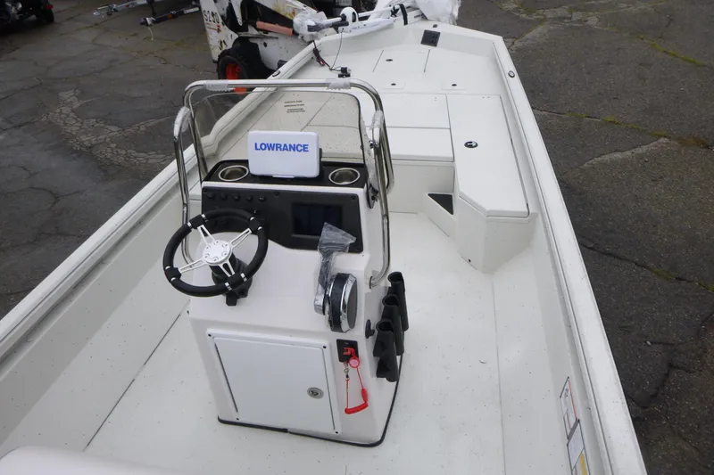 Slide: The Image of 2025 Ranger RB210 boat interior with steering console and Lowrance equipment. - 4