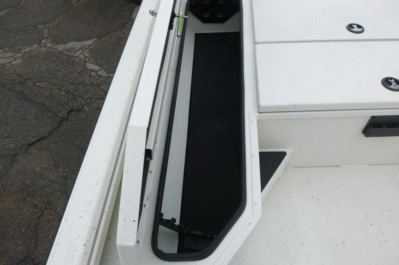 Slide: The Image of 2025 Ranger RB210 boat storage compartment with white finish and black interior. - 9