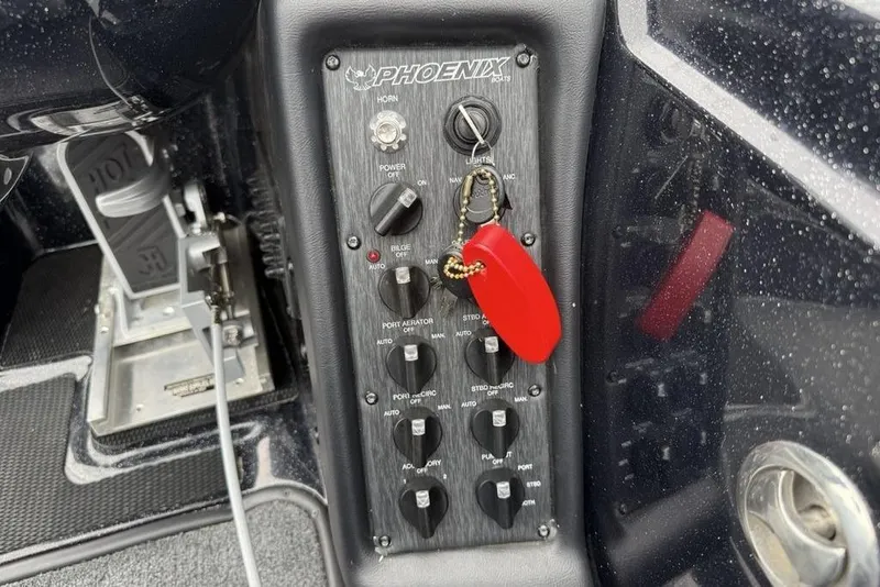 Slide: The Image of Control panel of 2019 Phoenix 921 PRO XP boat with red key fob. - 24