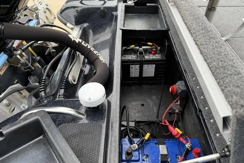 Slide: The Image of 2019 Phoenix 921 PRO XP boat battery compartment with wiring and components. - 27