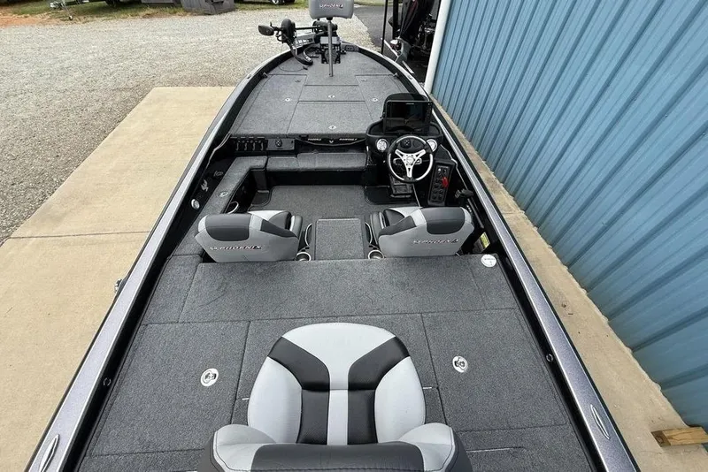 Slide: The Image of 2019 Phoenix 921 PRO XP boat interior with dual seats and steering console. - 29
