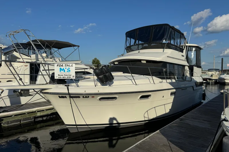 Slide: The Image of 1990 Carver 3807 Aft Cabin yacht for sale at marina dock. - 10