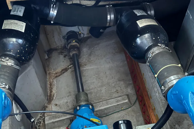 Slide: The Image of Engine room of a 1990 Carver 3807 Aft Cabin boat, showing mechanical components and piping. - 12