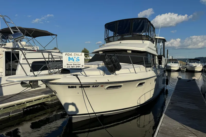 Slide: The Image of 1990 Carver 3807 Aft Cabin yacht for sale at marina dock. - 14