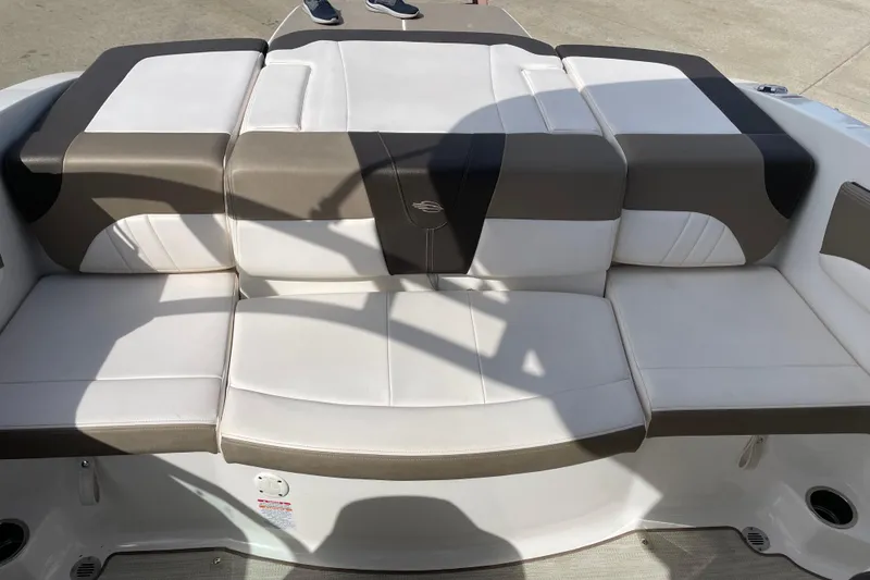 Slide: The Image of 2019 Chaparral 21 H2O Sport boat on display, featuring sleek black and white design. - 11