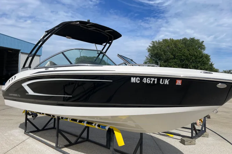 Slide: The Image of 2019 Chaparral 21 H2O Sport boat on display, featuring sleek design and powerful engine. - 18