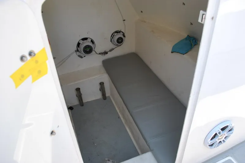 Slide: The Image of Interior of 2024 TomCat 36 boat cabin with seating and speakers. - 10
