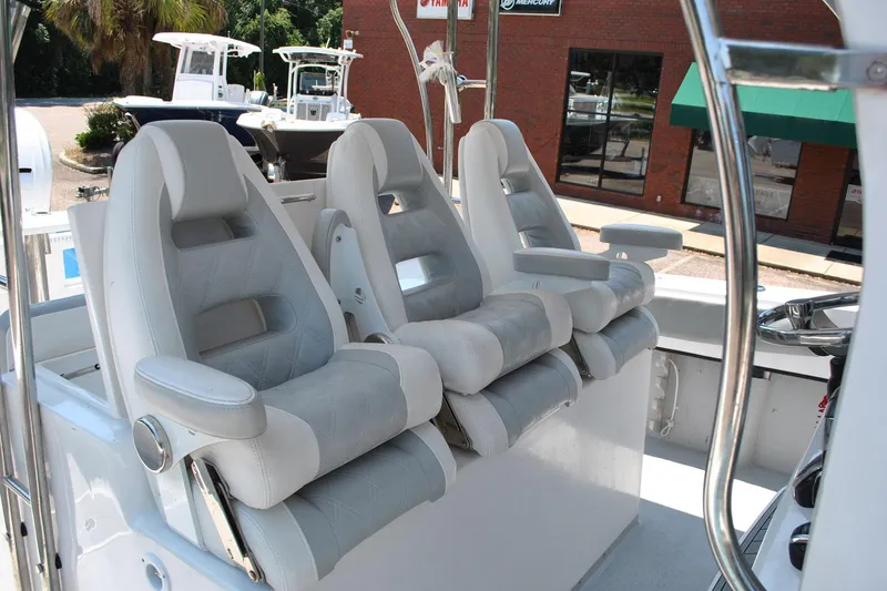 Slide: The Image of Luxury seating on 2024 TomCat 36 boat, featuring three plush captain's chairs. - 11