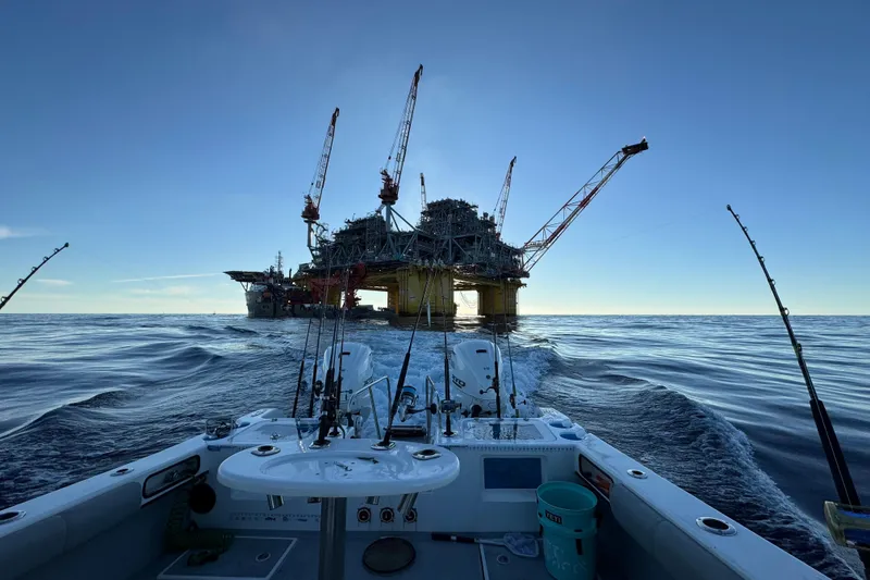 Slide: The Image of Fishing boat near offshore oil rig at sea, TomCat 36, 2024 model. - 18