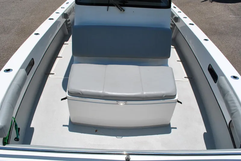 Slide: The Image of 2024 TomCat 36 boat interior with cushioned seating and spacious deck layout. - 5