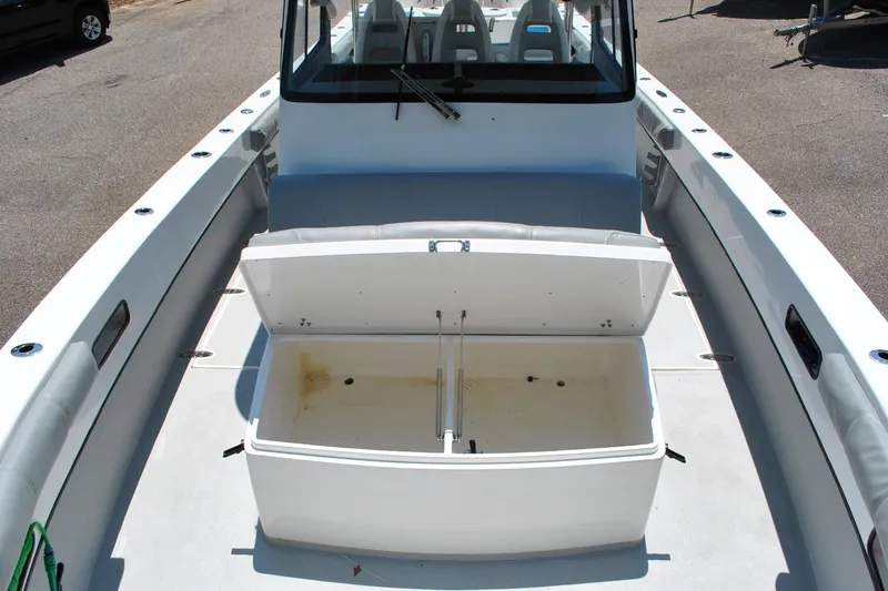 Slide: The Image of 2024 TomCat 36 boat with open storage compartment on deck. - 7