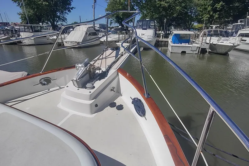 Slide: The Image of Bow view of 2001 Kadey-Krogen 39 yacht docked in a marina. - 12