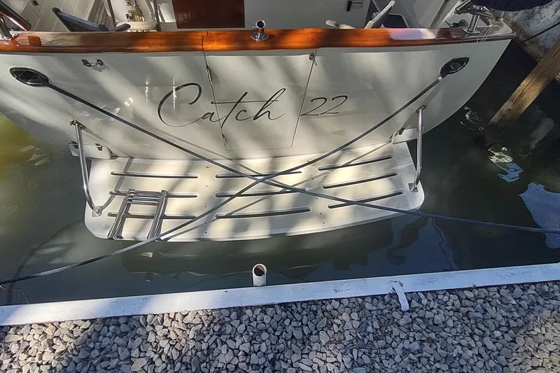 Slide: The Image of Kadey-Krogen 39 boat named "Catch 22" docked, rear view, 2001 model. - 20