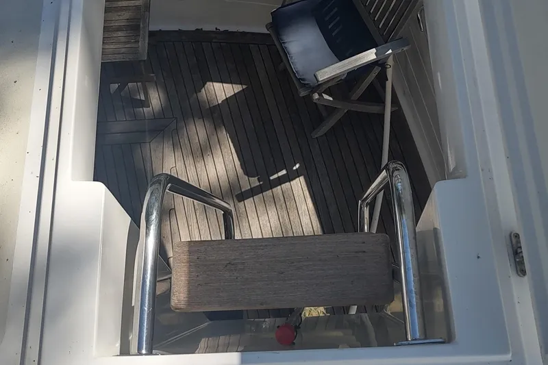 Slide: The Image of Kadey-Krogen 39 yacht deck with wooden flooring and folding chair, 2001 model. - 22